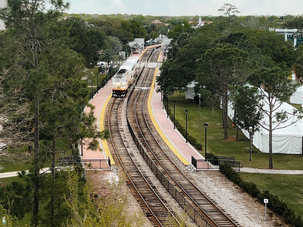 Railway line through green trees in Florida, seen from above