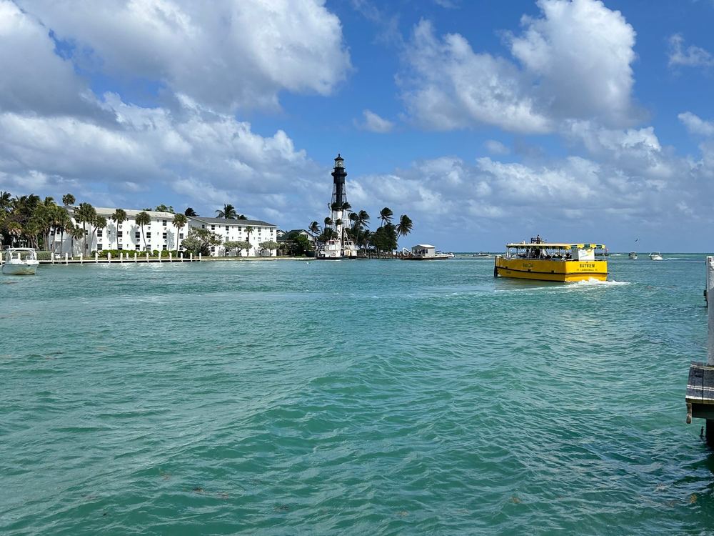 The Hillsboro Inlet Lighthouse next to Pompano Beach on a sunny day